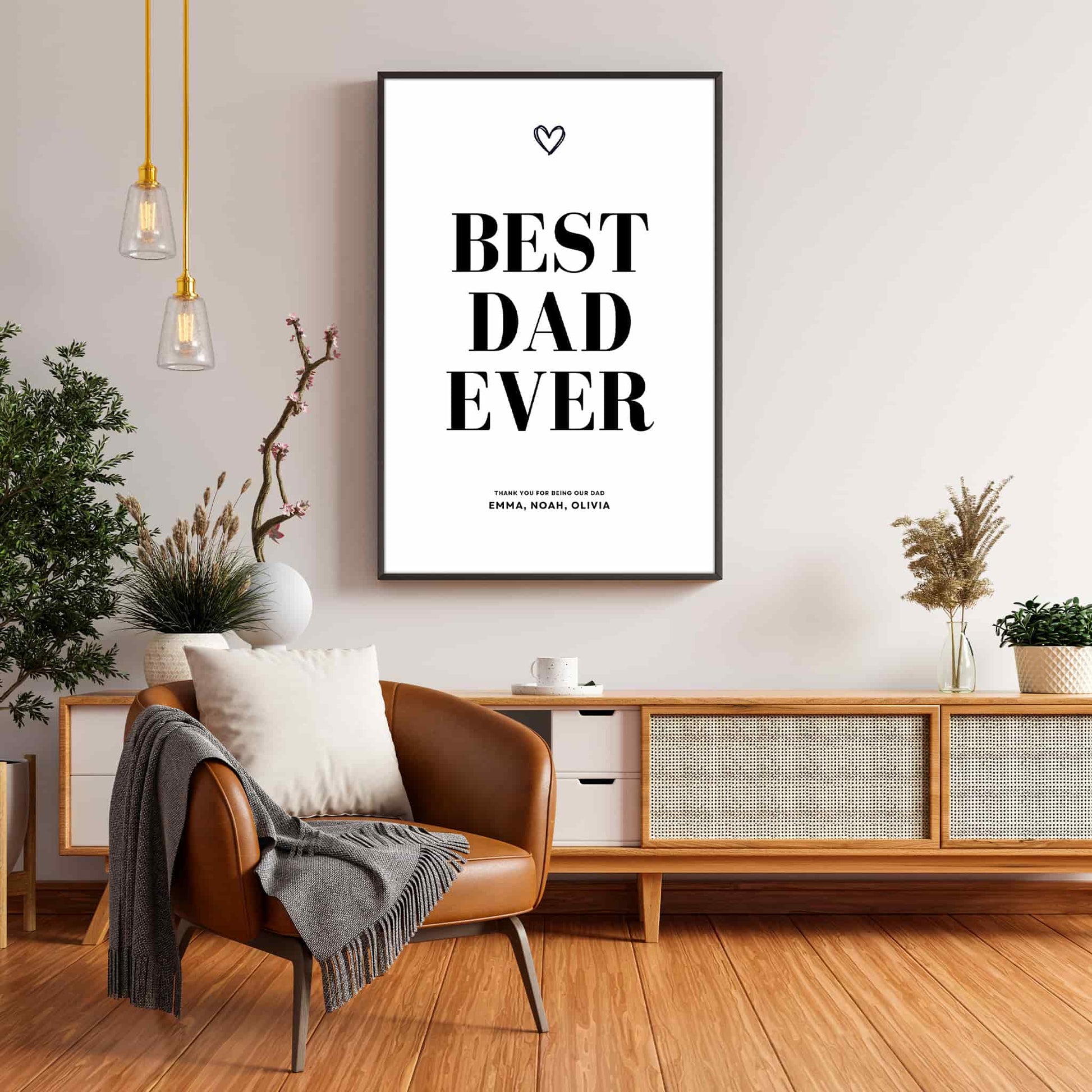 Framed ‘Best Dad Ever’ poster with minimalist black text and small heart design, displayed in a cozy modern living room.